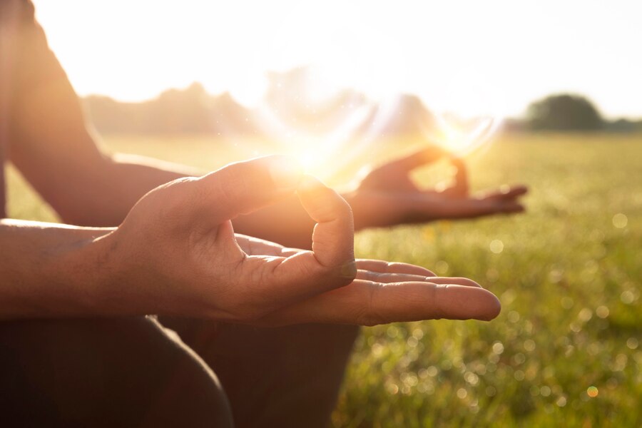 side-view-adult-meditating-outdoors_23-2149711528